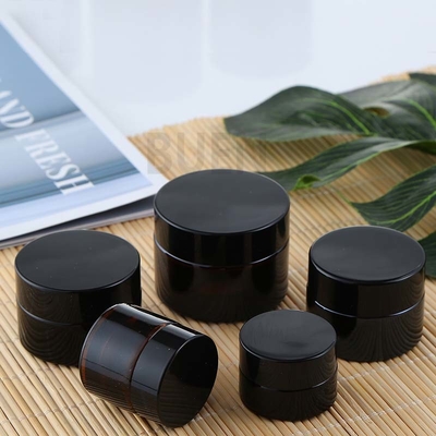 Cylinder Amber Face Cream Glass Cosmetic Jars With Black Lid ISO90001